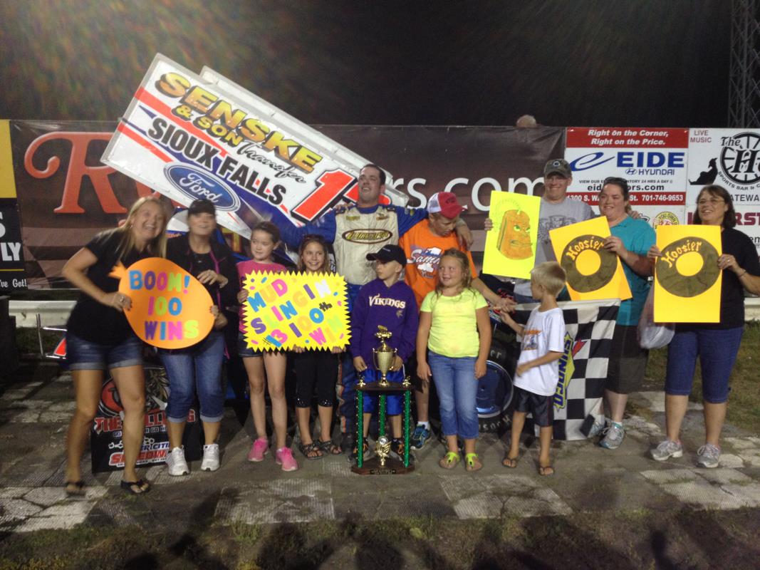 Mark and some of his fans celebrate his 100th win at River Cities Speedway