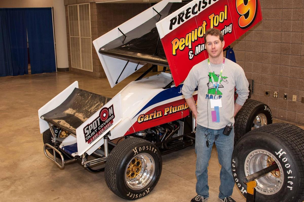 Greg standing with the car at the MAAP conference, February 2015.