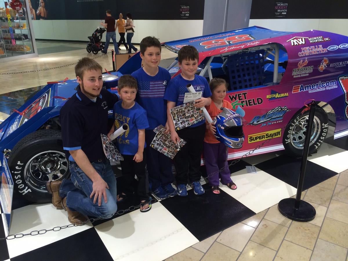 Driver Anthony Roth poses with some young fans at the Cooper/RAD Racing display at Gateway Mall in Lincoln, NE in March, 2015.