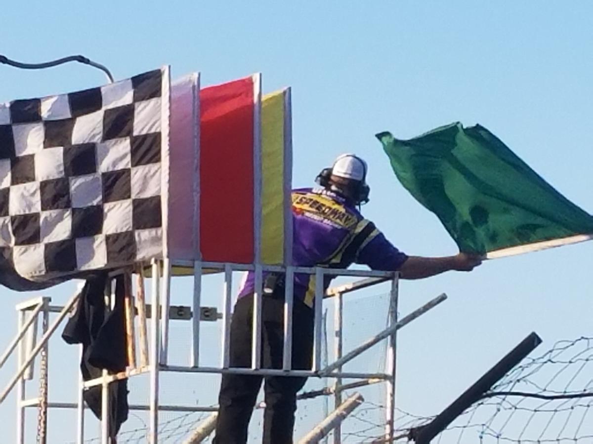 Nathan Peterson waves the green for the field at Park Jefferson Speedway's South Dakota Sprint Car Nationals.