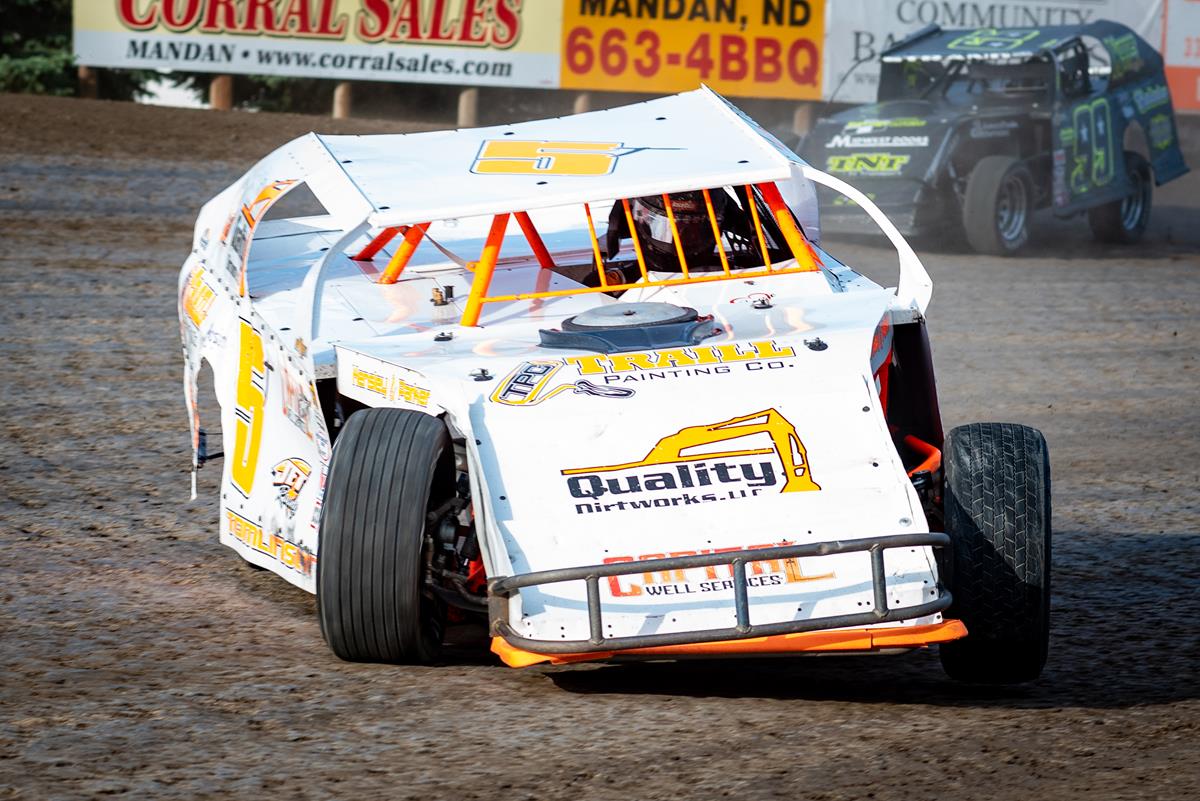 TOMLINSON WINS RAIN SHORTENED FEATURE VICTORY