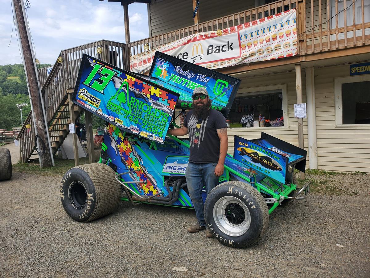 Penn Can Speedway Fans Donate $2,009 To Happiness House During Autism Awareness Night