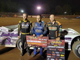 MAX BLAIR'S LATE RACE PASS IN FRONT OF A SRO CROWD AT TYLER COUNTY PART OF THE "HILLBILLY 100" EARNS HIM HIS 4TH HOVIS RUSH LATE MODEL FLYNN'S TIRE TO
