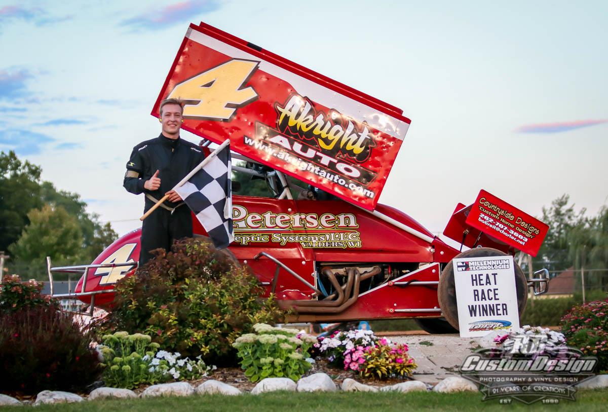 Alex Pokorski stands tall on Plymouth Dirt Track Racing 360 Sprint Car podium