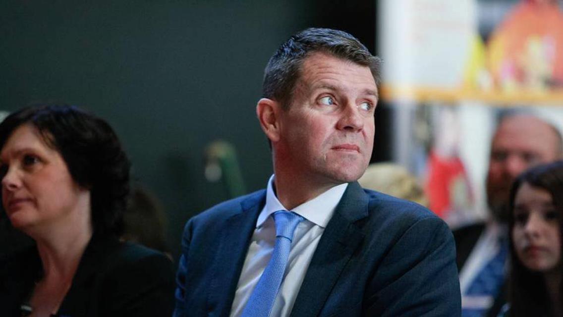 The Premier of NSW Mike Baird go-karting in Albion Park