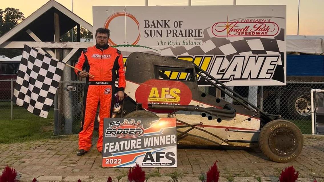 Neuman Triumphs in Last Lap Thriller