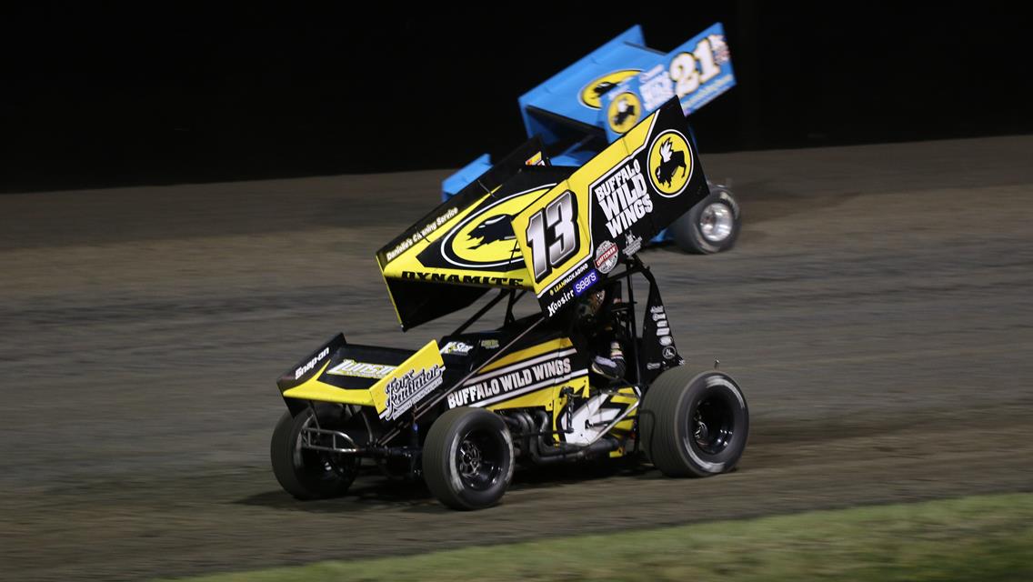 Local favorites, Mark Dobmeier of Grand Forks (13) and Thomas Kennedy of Winnipeg, Manitoba (21K), race side by side during the Outlaws feature in 2018 at Red River Valley Speedway.