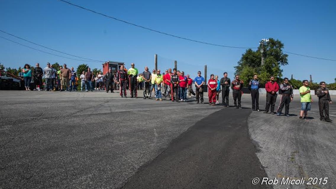 Race Teams Stand for the National Anthem