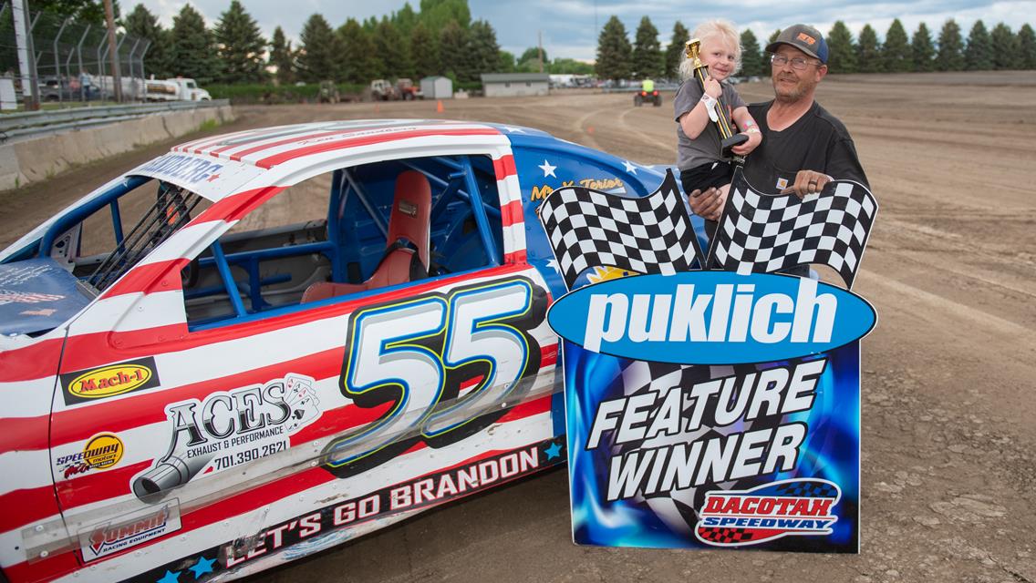 SANDBERG MUSCLES INTO VICTORY LANE