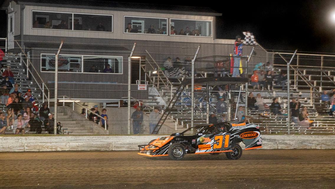 Phillips beats rain for first career win; Knisley out duels Wilson