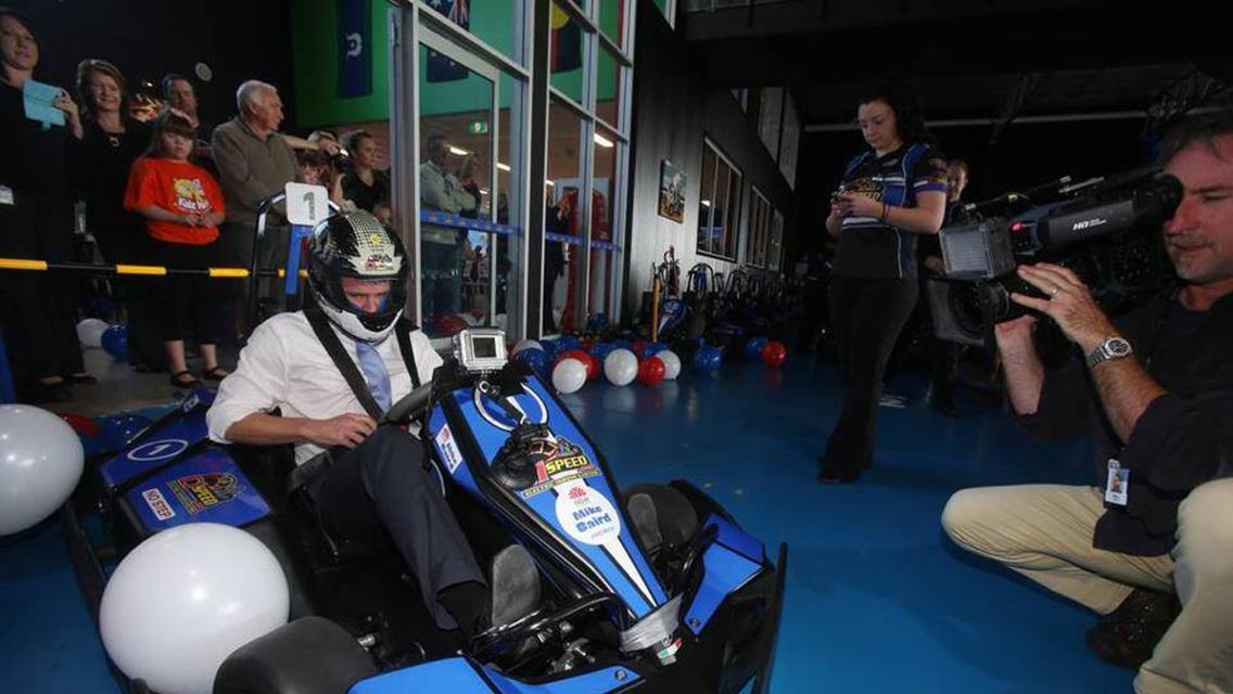 The Premier of NSW Mike Baird go-karting in Albion Park