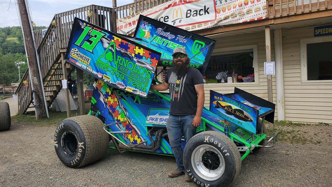 Penn Can Speedway Fans Donate $2,009 To Happiness House During Autism Awareness Night
