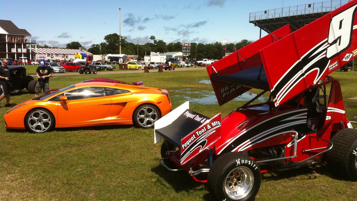 The #9 with fresh paint and graphics next to a Lamborghini at the BIR Powercruise.